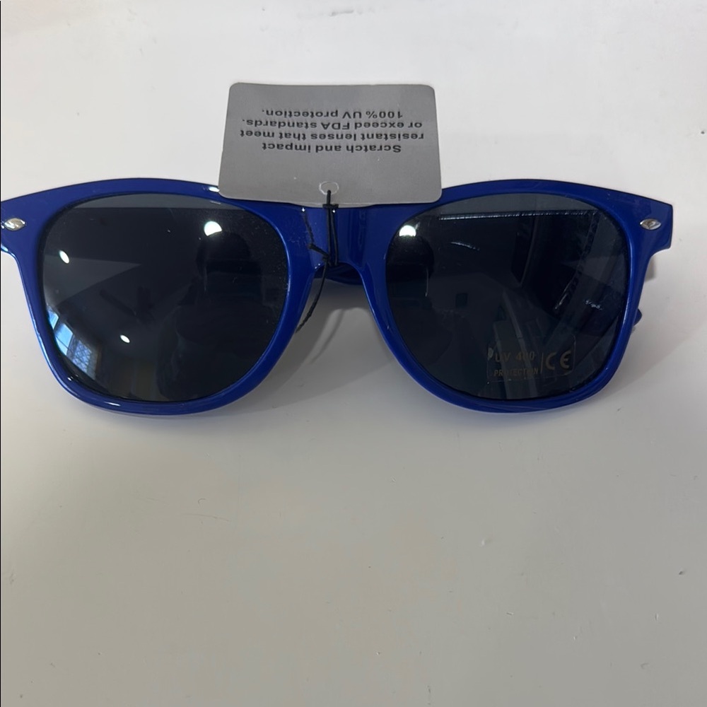 Blue Sunglasses with Dark Lenses and UV protection. Scratch proof